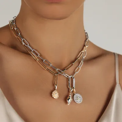 Fancy pendant with 0.91 carats* of diamond simulants in 10 carat yellow gold and sterling silver